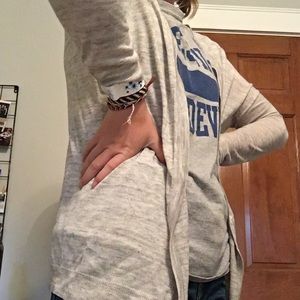 Light grey cardigan.